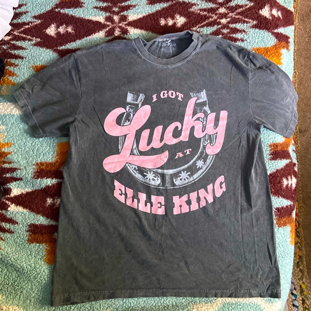 I got lucky at Elle king shirt size large. Worn and washed once. Gray and pink